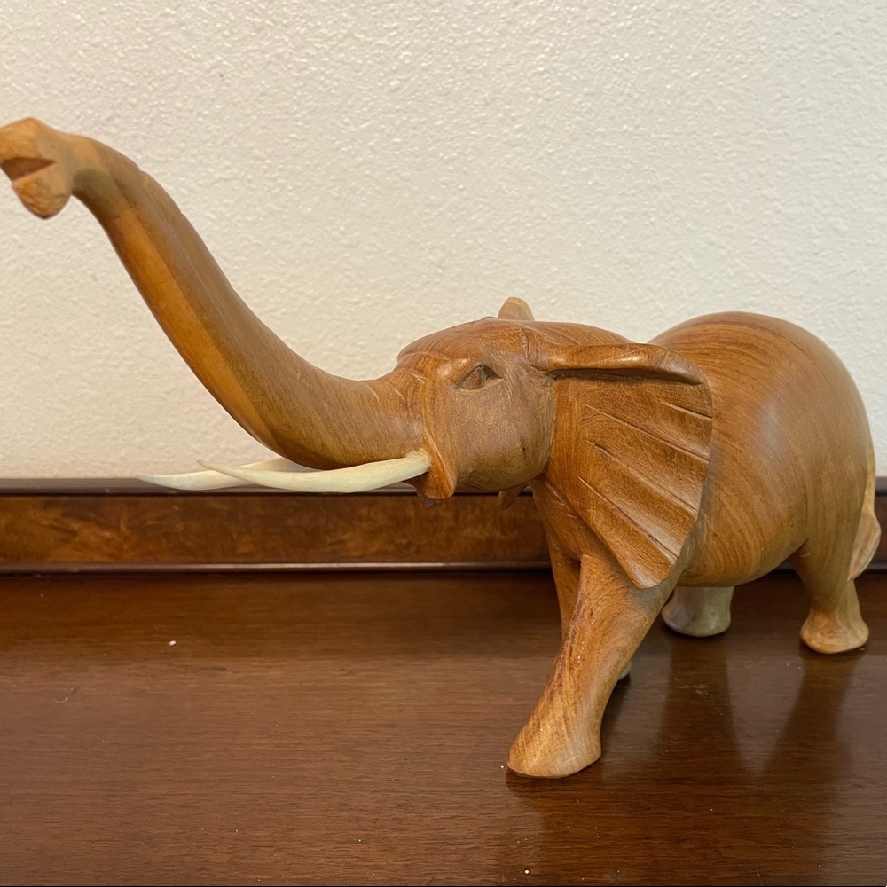beautiful hand carved elephant with tusks 6” tall.